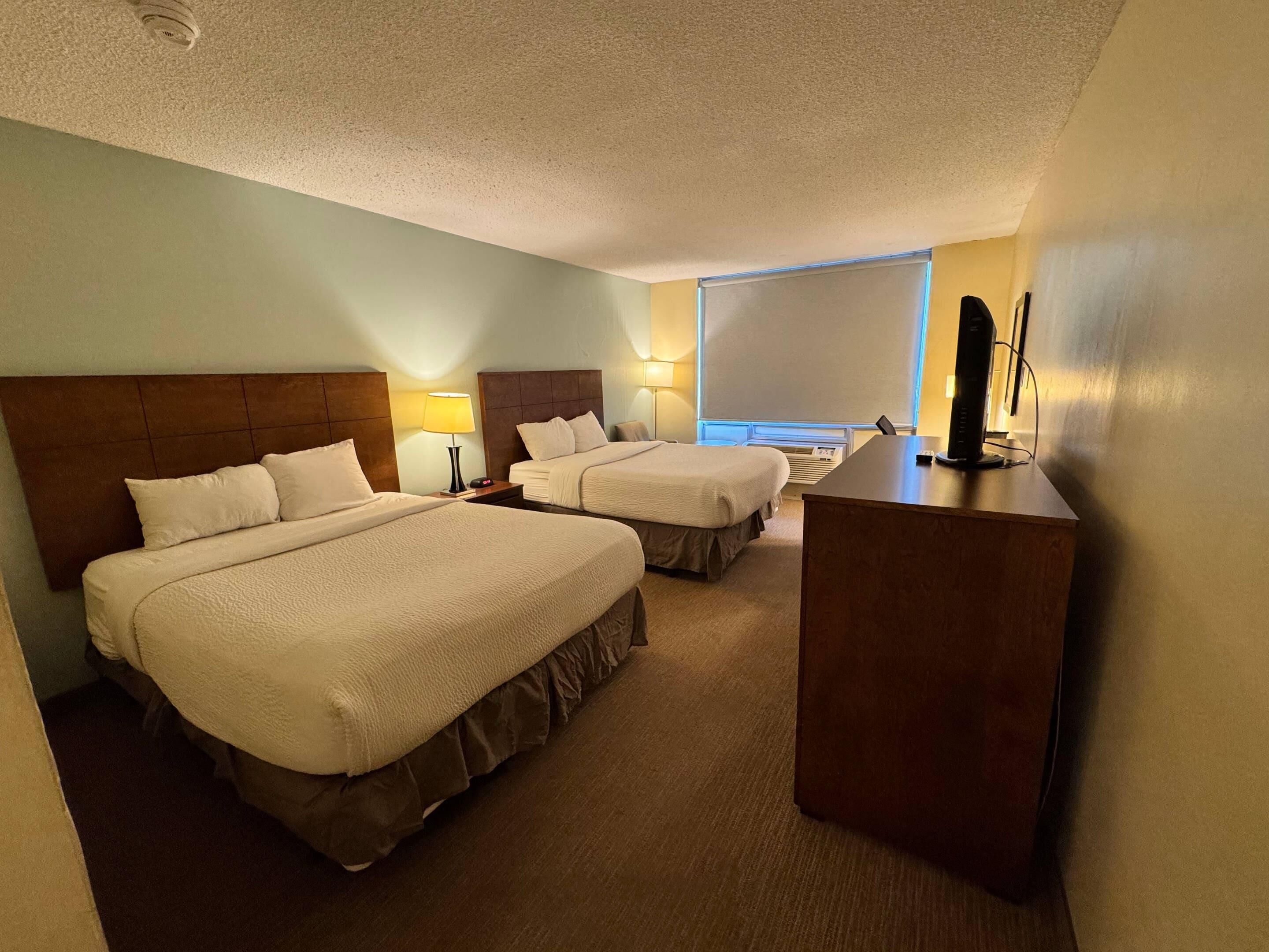 Standard Room, 2 Queen Beds, Non Smoking | In-room safe, desk, iron/ironing board, free cots/infant beds