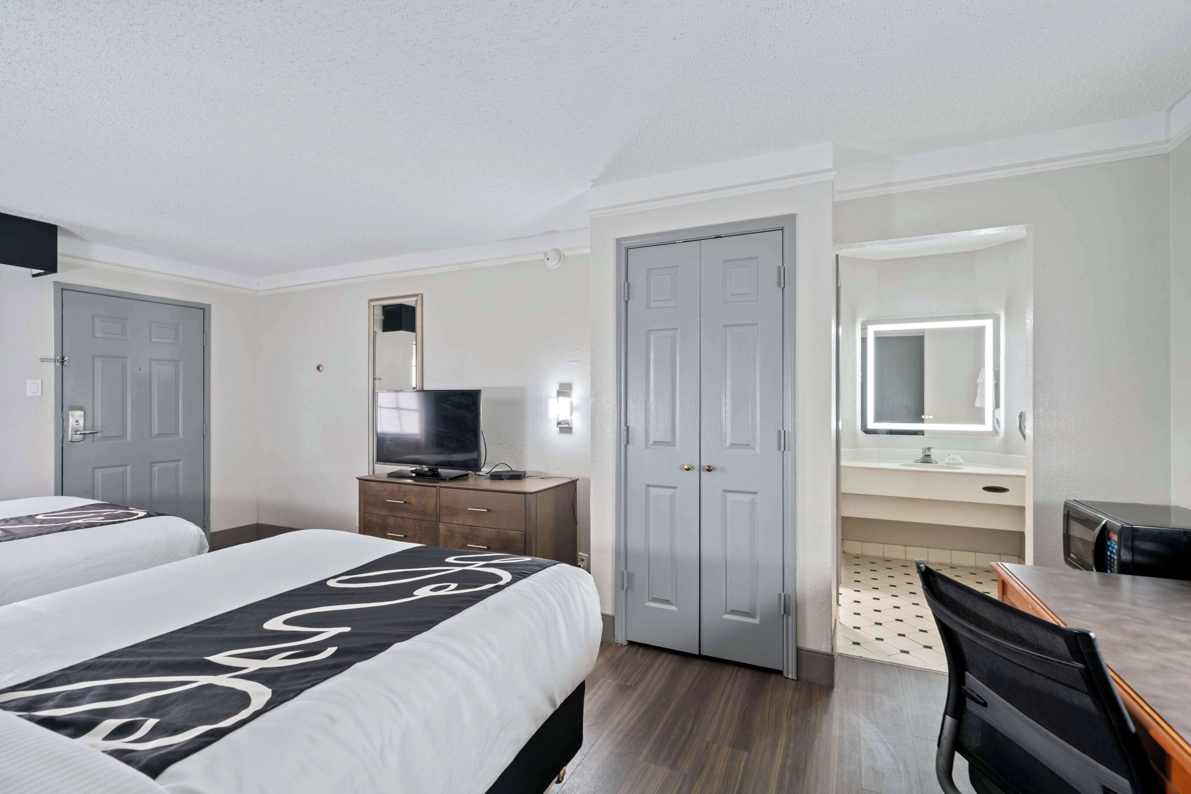 Pillowtop beds, desk, blackout drapes, iron/ironing board
