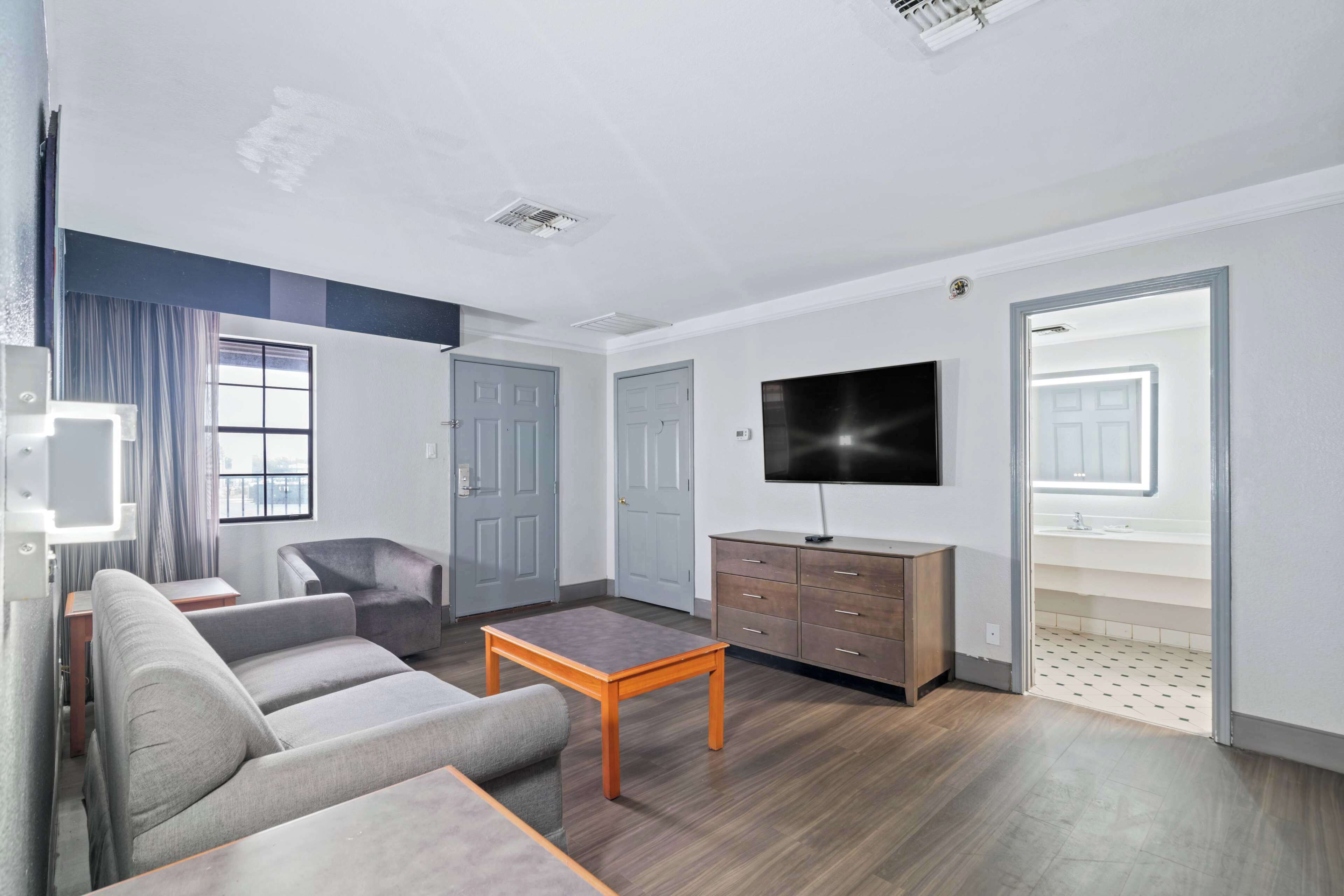 pillow-top beds, desk, blackout curtains, iron/ironing board