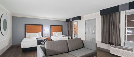 Pillowtop beds, desk, blackout drapes, iron/ironing board