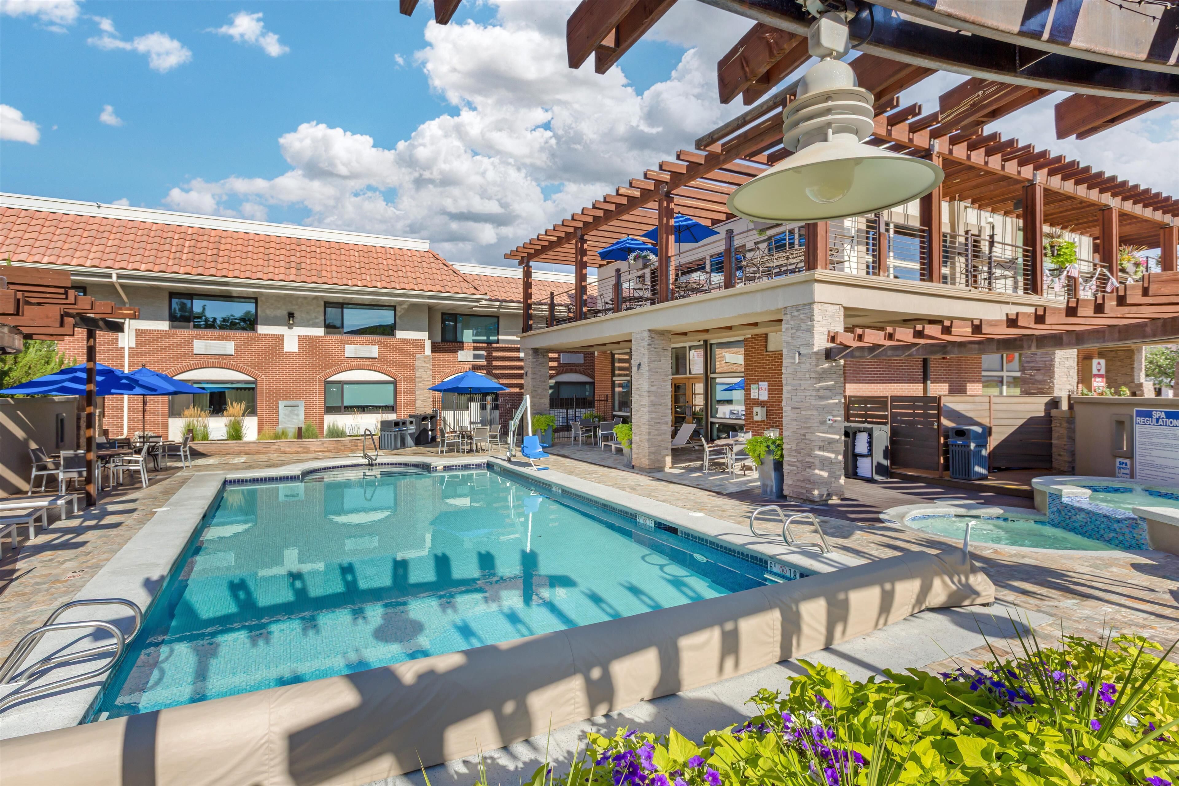 seasonal outdoor pool, open 9:00 am to 10:00 pm, pool umbrellas