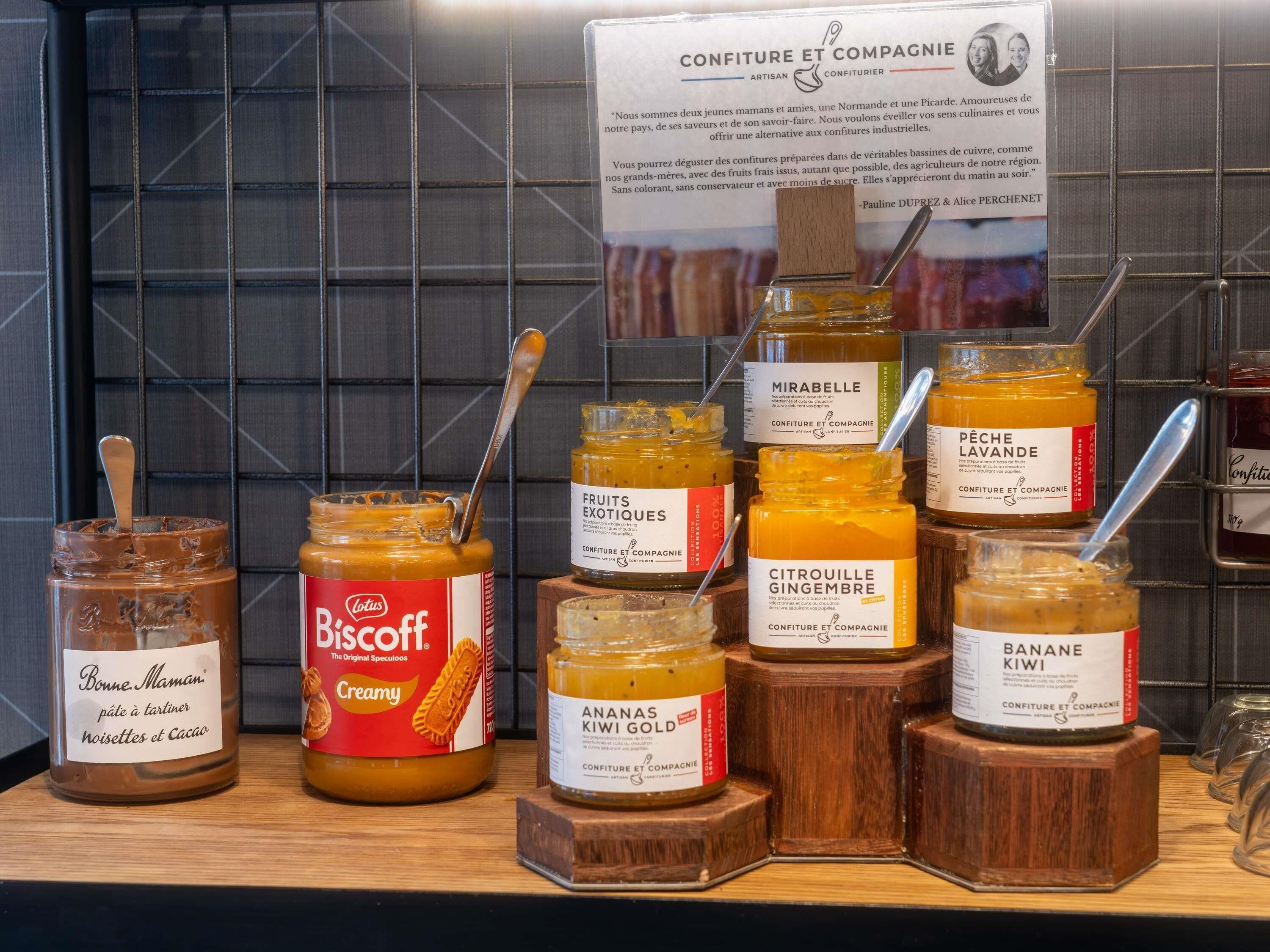 A selection of artisanal food products on display, including various jams and spreads.