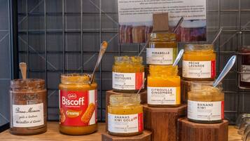 A selection of artisanal food products on display, including various jams and spreads.