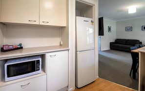 Apartment, 3 Bedrooms | Private kitchen | Mini-fridge, microwave, coffee/tea maker, electric kettle