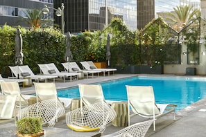 Outdoor pool, pool umbrellas, sun loungers - The LINE Hotel (Los Angeles)