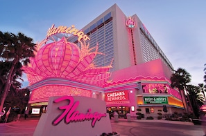 The Flamingo Hotel with a prominent neon sign, Caesars Rewards, and Bugsy & Meyer's Steakhouse.