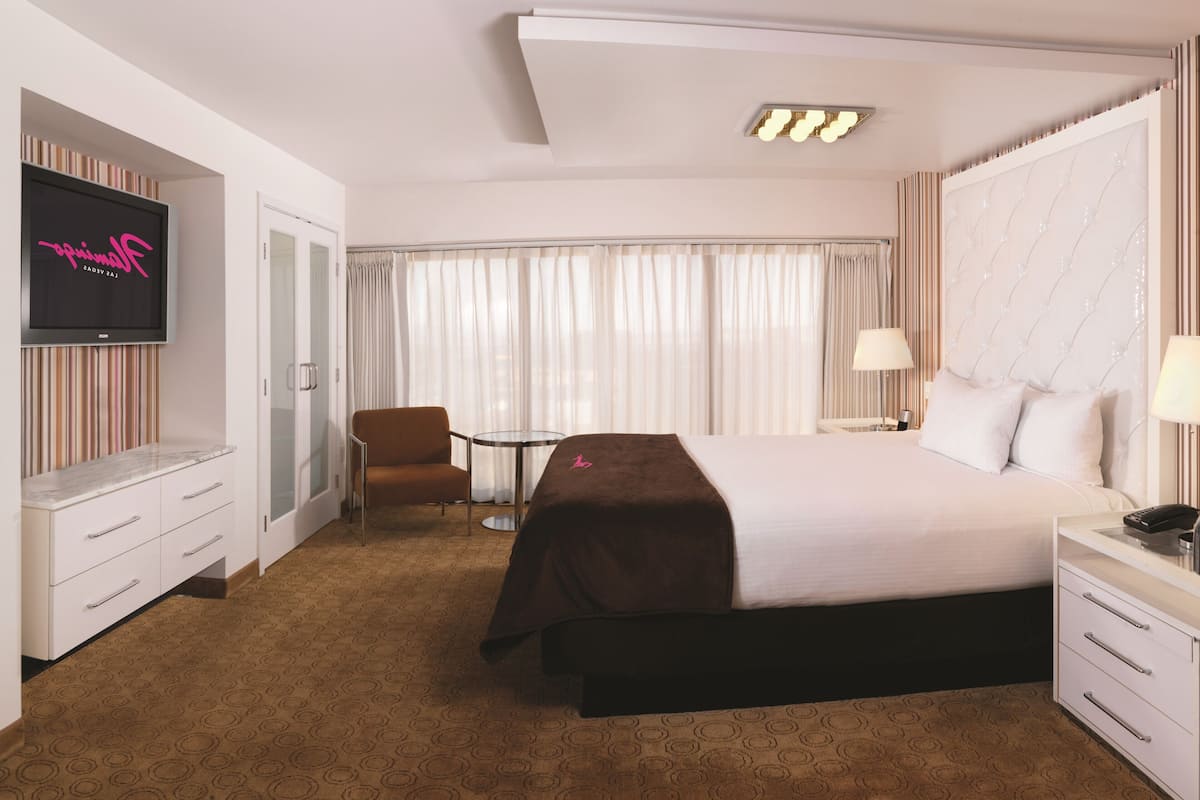 GO Premium Suite, 1 King, Non-Smoking | Pillowtop beds, in-room safe, desk, laptop workspace