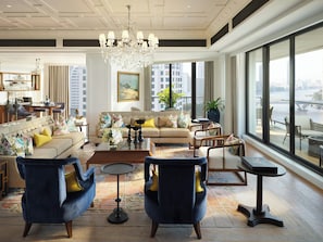A spacious living room with a large chandelier, a sofa set, armchairs, and a view of the city through large windows. - Mandarin Oriental, Bangkok (Bangkok)