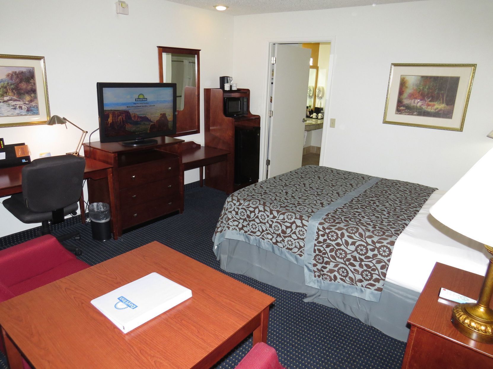 Premium bedding, desk, laptop workspace, blackout curtains