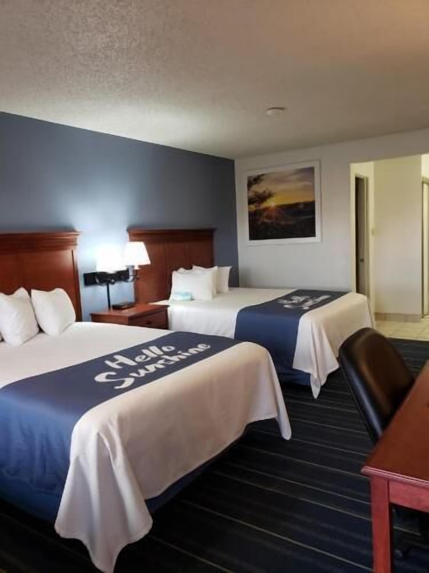 Premium bedding, desk, laptop workspace, blackout curtains