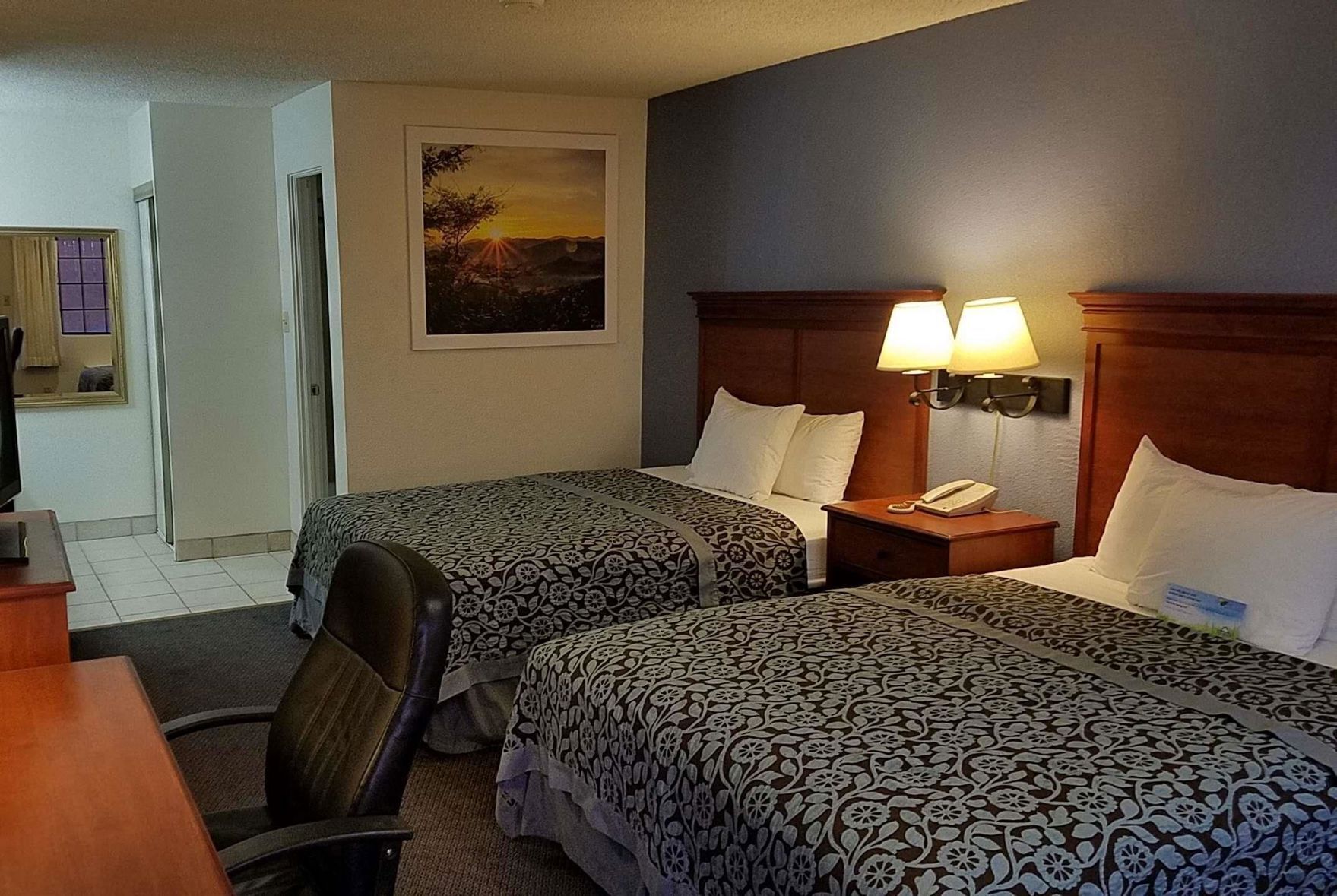 Premium bedding, desk, laptop workspace, blackout curtains