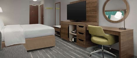 Une chambre d’hôtel comprenant un lit, un bureau avec un téléviseur à écran plat, une chaise, un miroir et un sol recouvert de moquette.