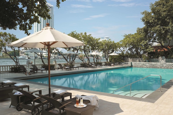 2 outdoor pools, open 7:00 AM to 7:00 PM, pool umbrellas, pool loungers