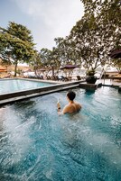2 outdoor pools, open 7:00 AM to 7:00 PM, pool umbrellas, pool loungers