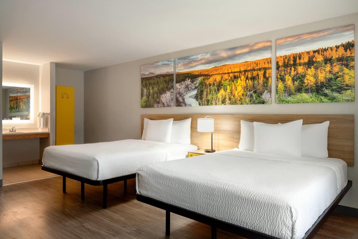 Room, 2 Queen Beds, Non Smoking (Mobility, Bathtub w/Grab bars) | Iron/ironing board, free WiFi, bed sheets, alarm clocks