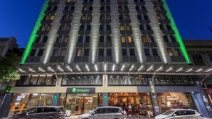 A multi-story hotel with a modern facade, a Holiday Inn sign, and a covered entrance area. - Holiday Inn Perth City Centre by IHG (Perth)