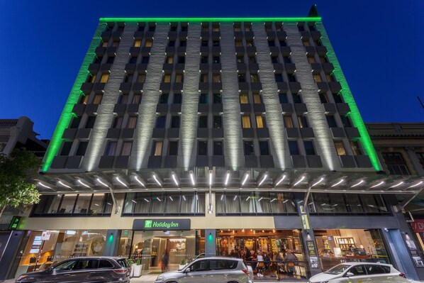 A multi-story hotel with a modern facade, a Holiday Inn sign, and a covered entrance area. - Holiday Inn Perth City Centre by IHG (Perth)