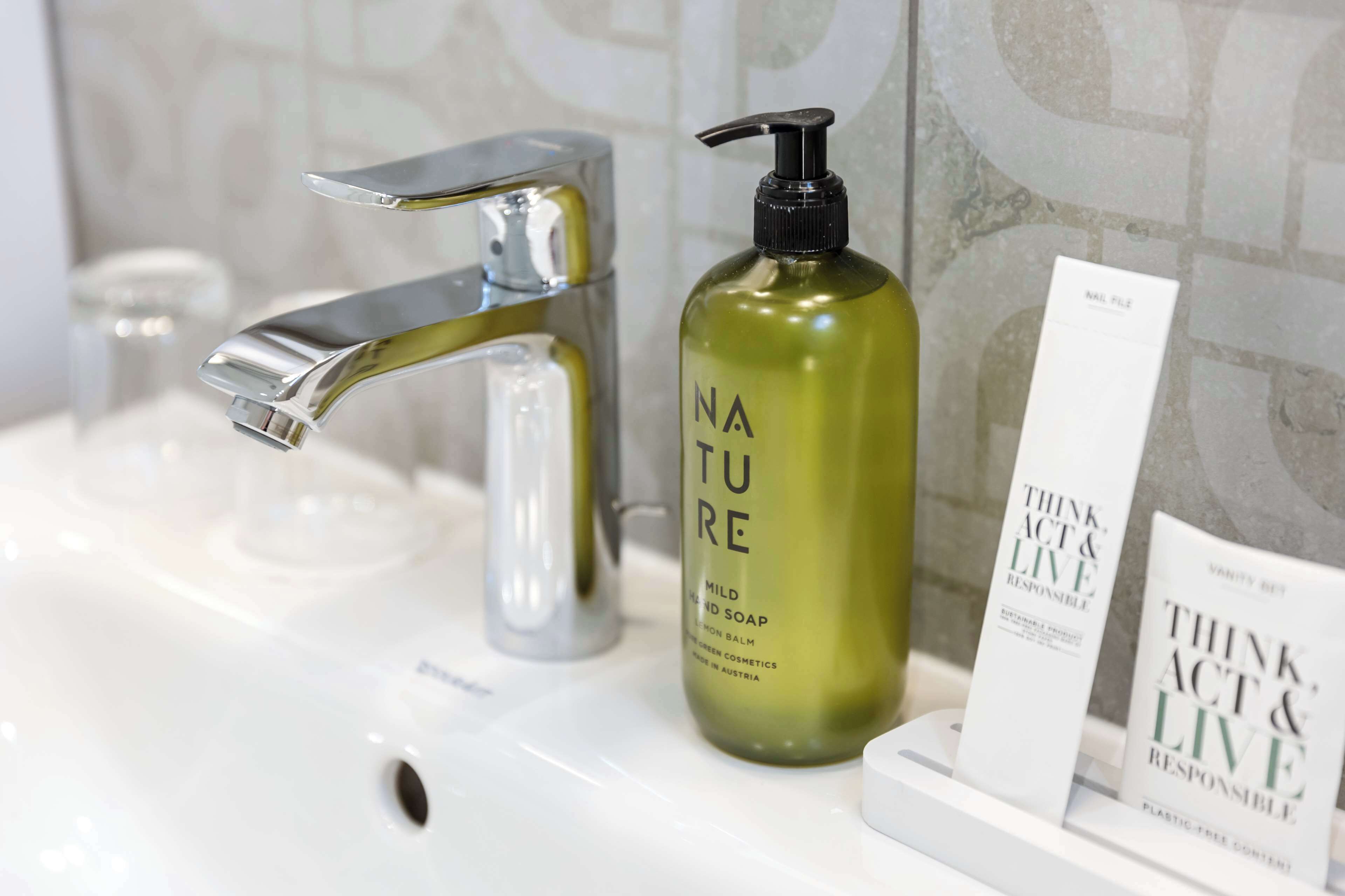 hair dryer, towels, soap, shampoo