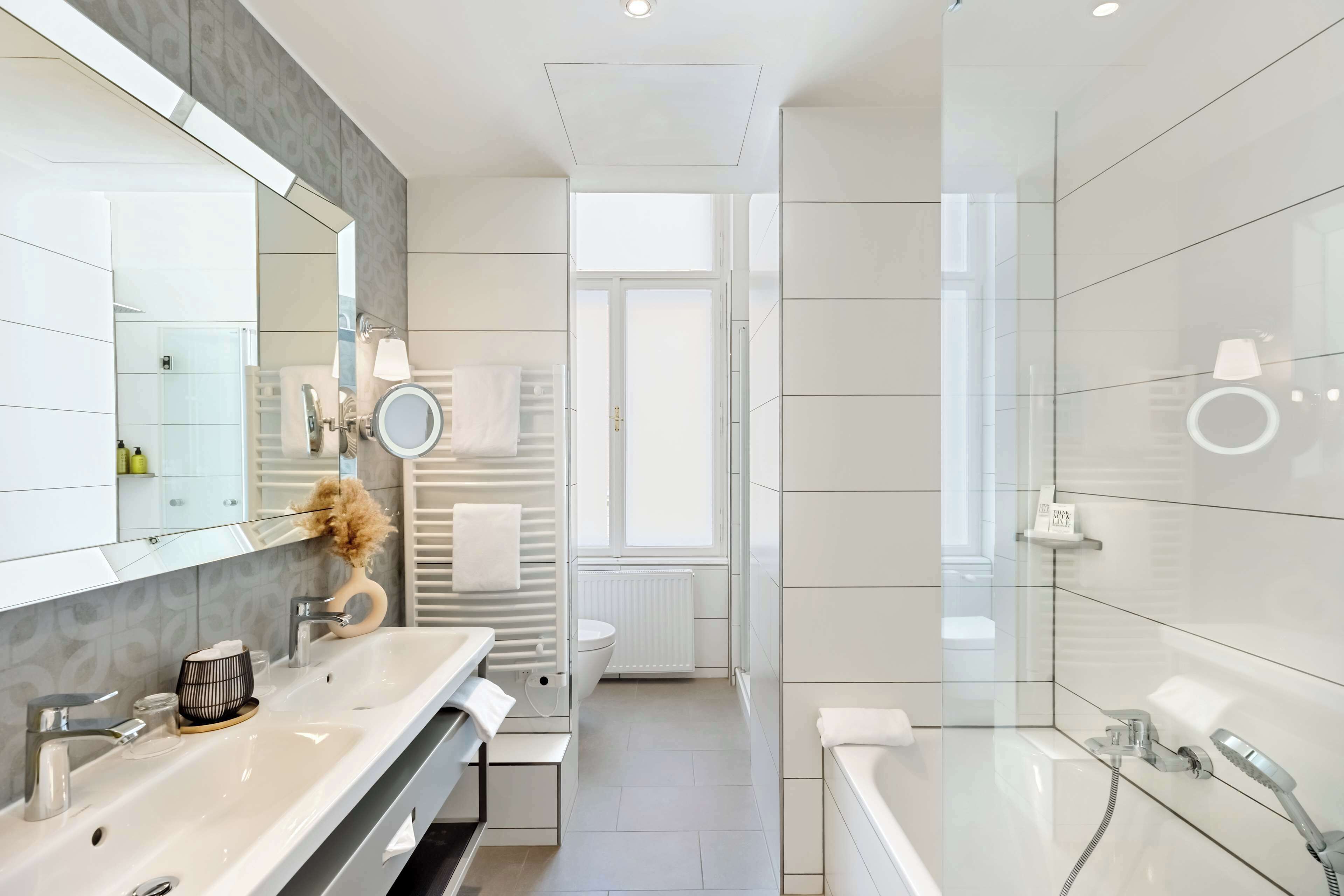 suite | bathroom | hair dryer, towels, soap, shampoo