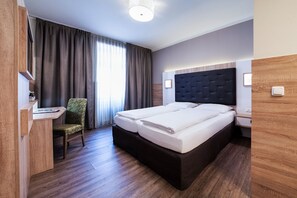 Hypoallergeen beddengoed, een minibar, een kluis op de kamer, een bureau