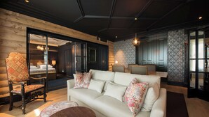 A modern living room with a sofa, armchairs, and a coffee table. - Scandic Holmenkollen Park (Oslo)