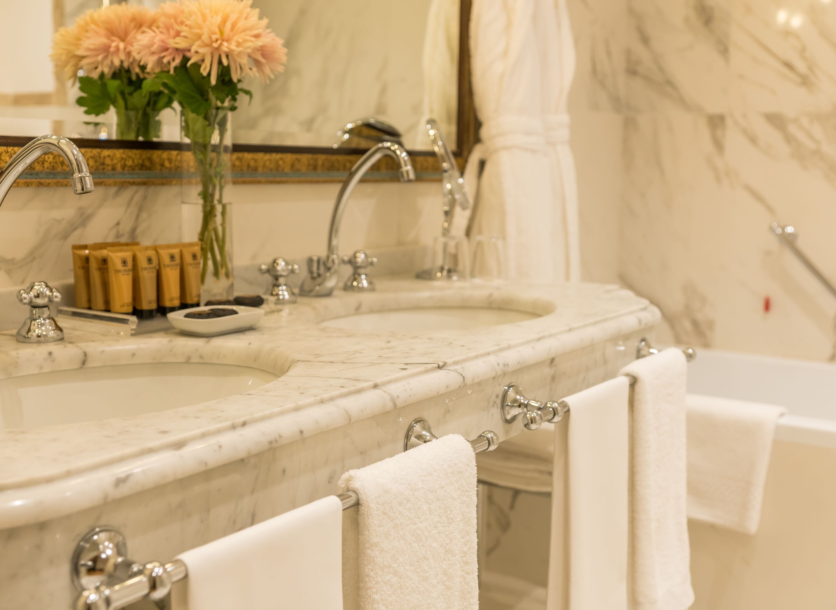 designer toiletries, hair dryer, bidet, towels