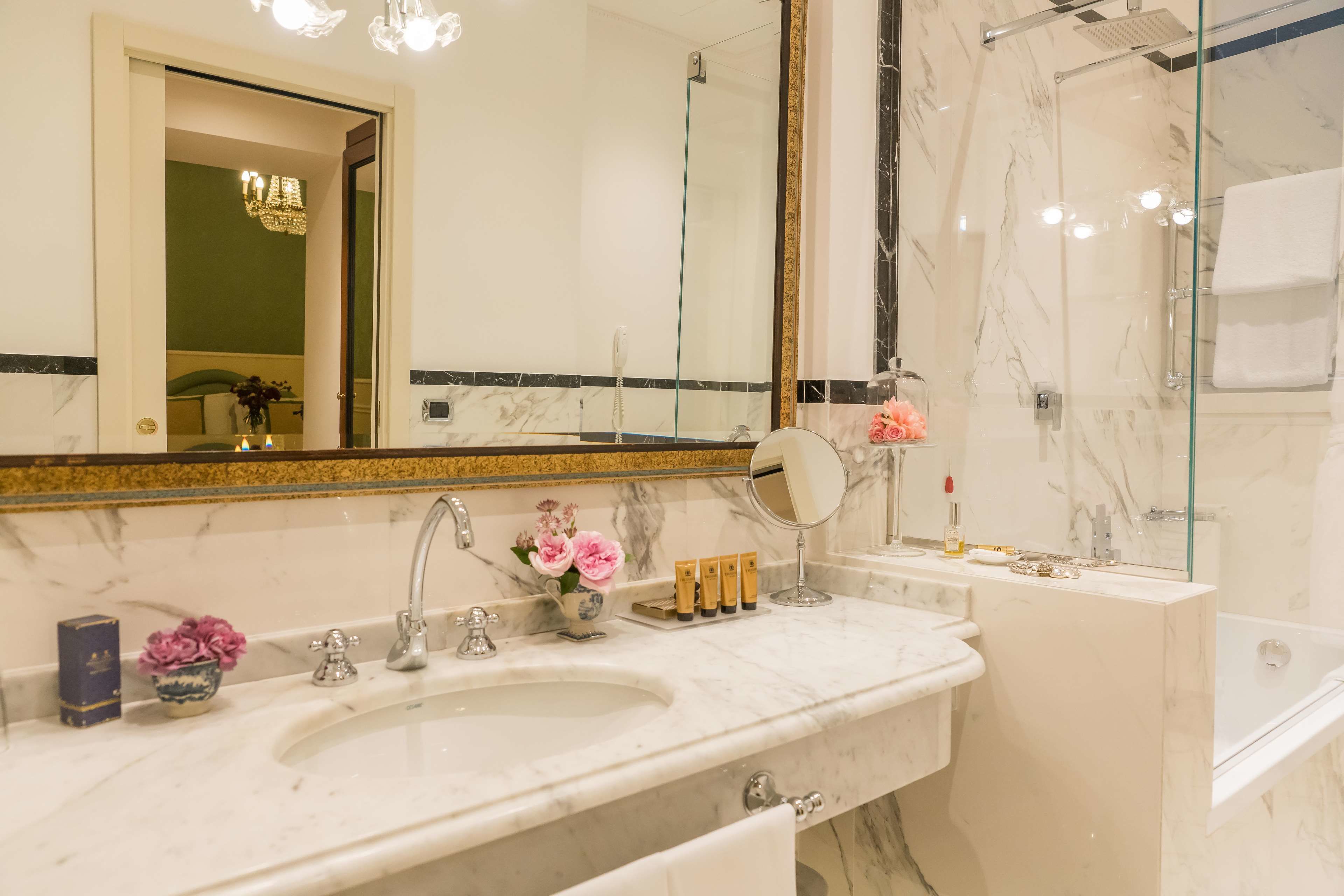 designer toiletries, hair dryer, bidet, towels