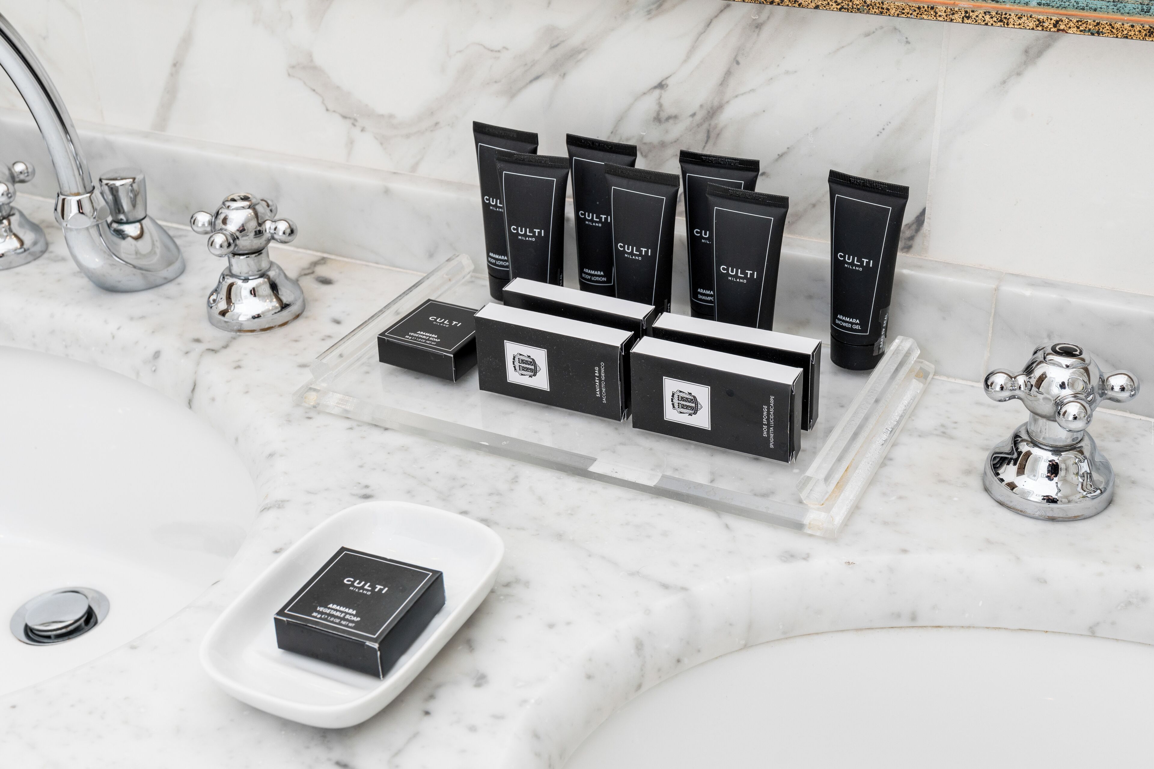 designer toiletries, hair dryer, bidet, towels