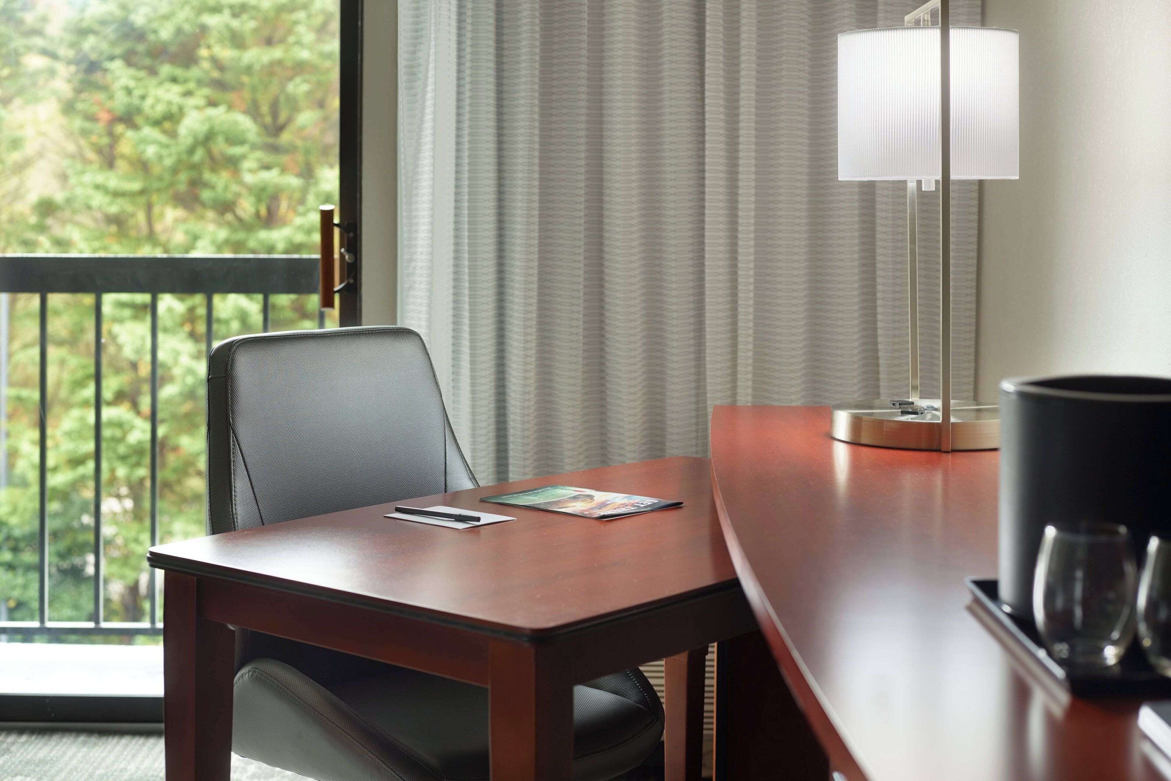 premium bedding, desk, laptop workspace, blackout curtains