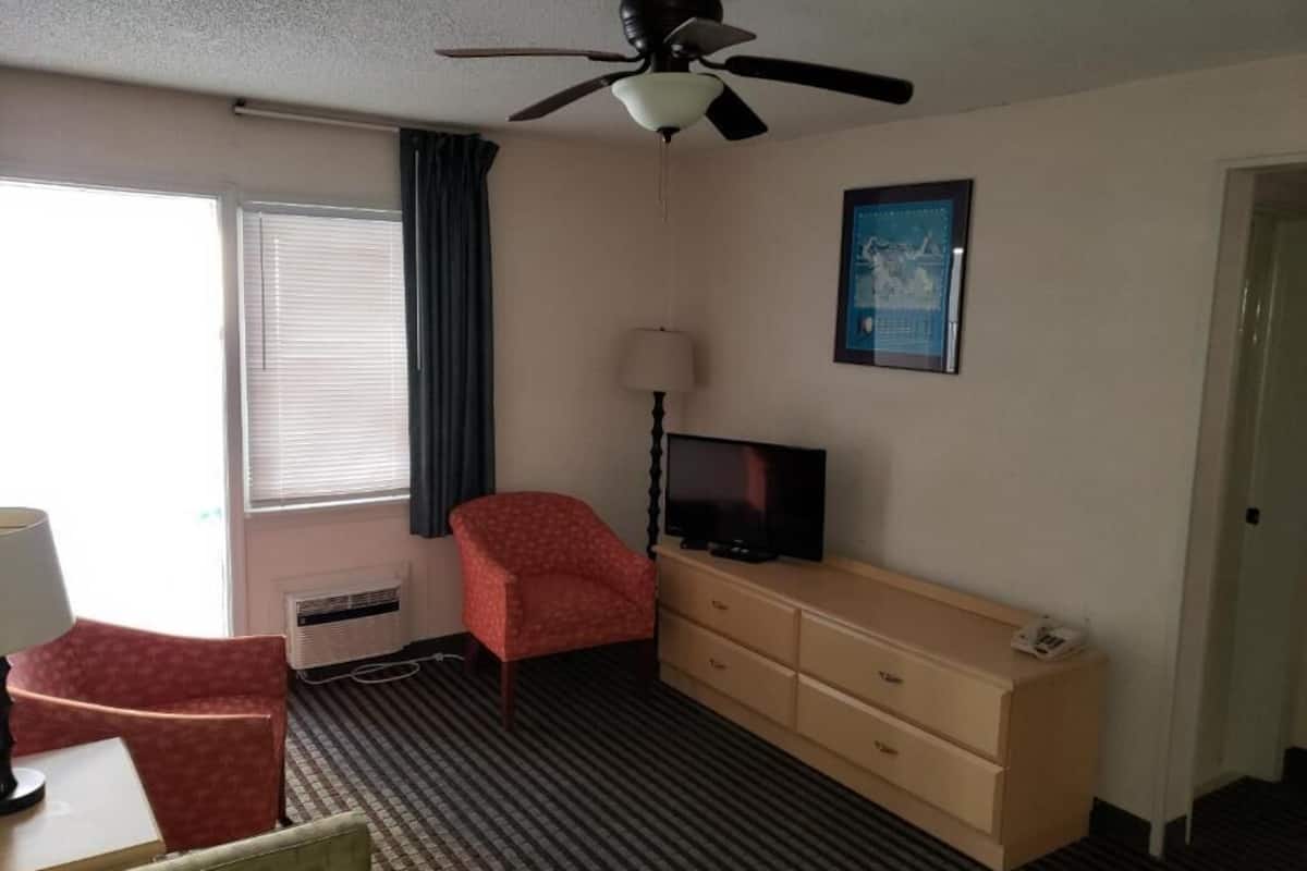 Desk, laptop workspace, blackout curtains, iron/ironing board