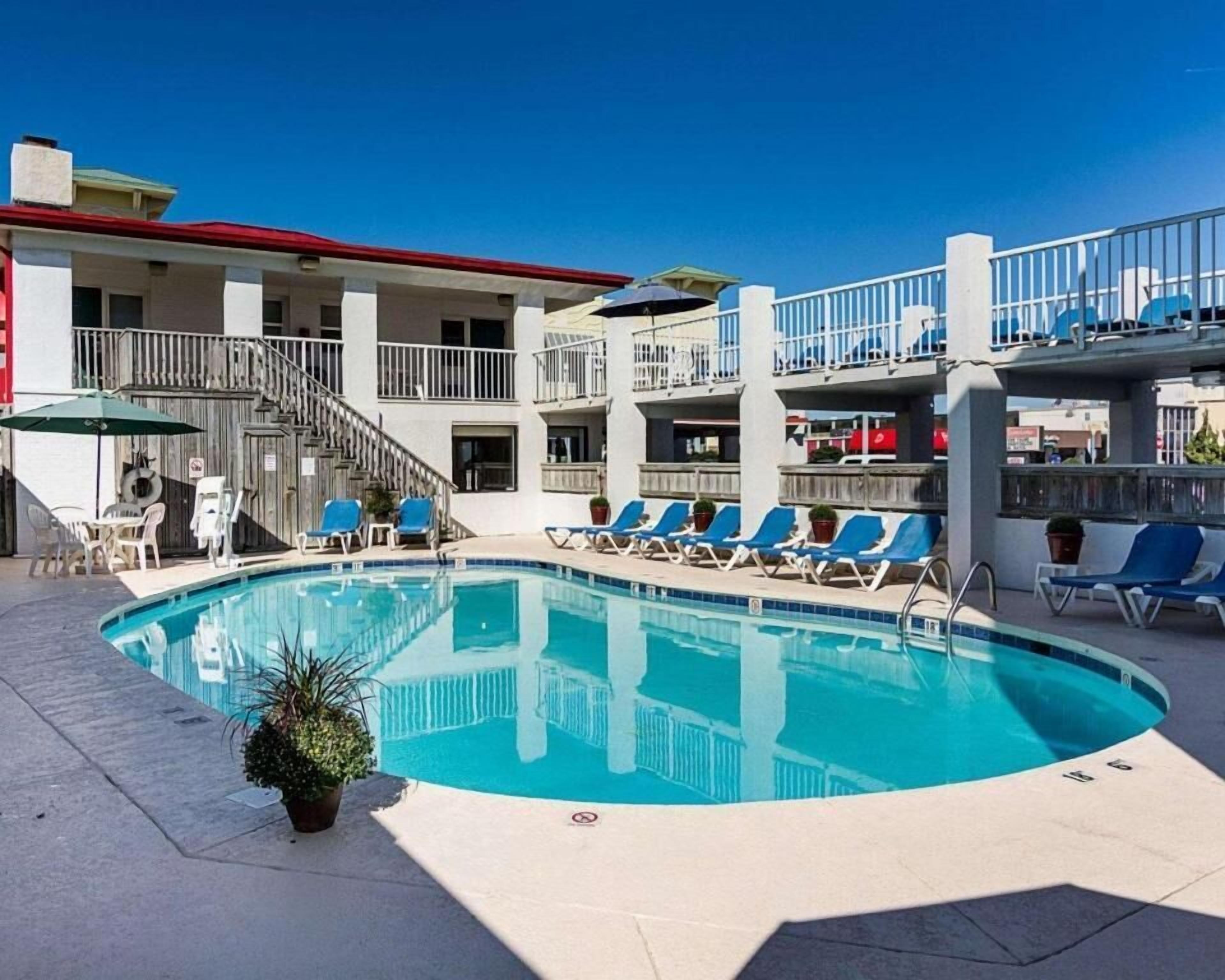 Seasonal outdoor pool, open 9:00 AM to 9:00 PM, pool umbrellas