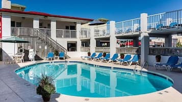 Seasonal outdoor pool, open 9:00 AM to 9:00 PM, pool umbrellas
