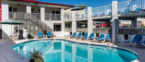 Seasonal outdoor pool, open 9:00 AM to 9:00 PM, pool umbrellas
