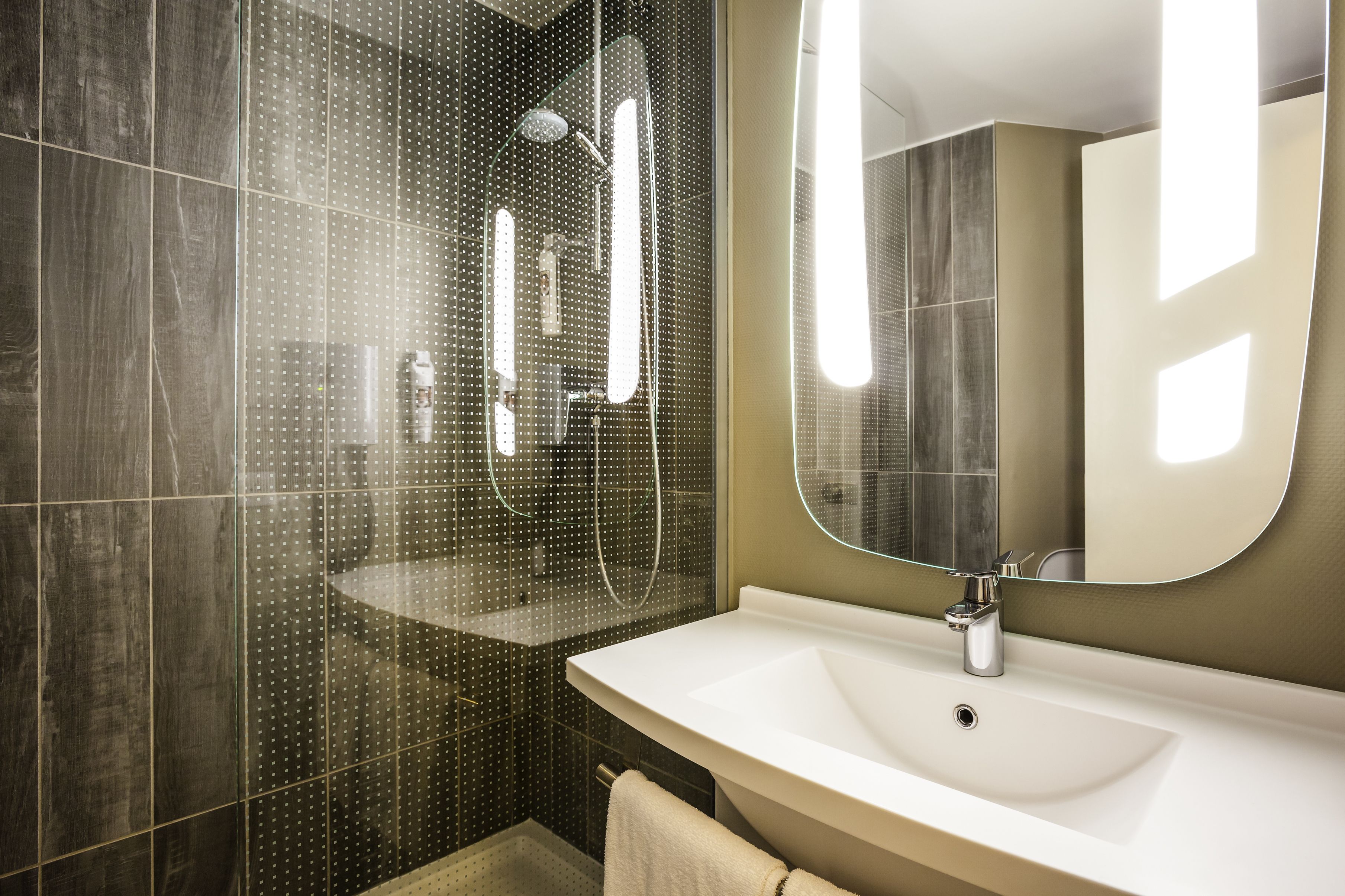 shower, eco-friendly toiletries, hair dryer, towels