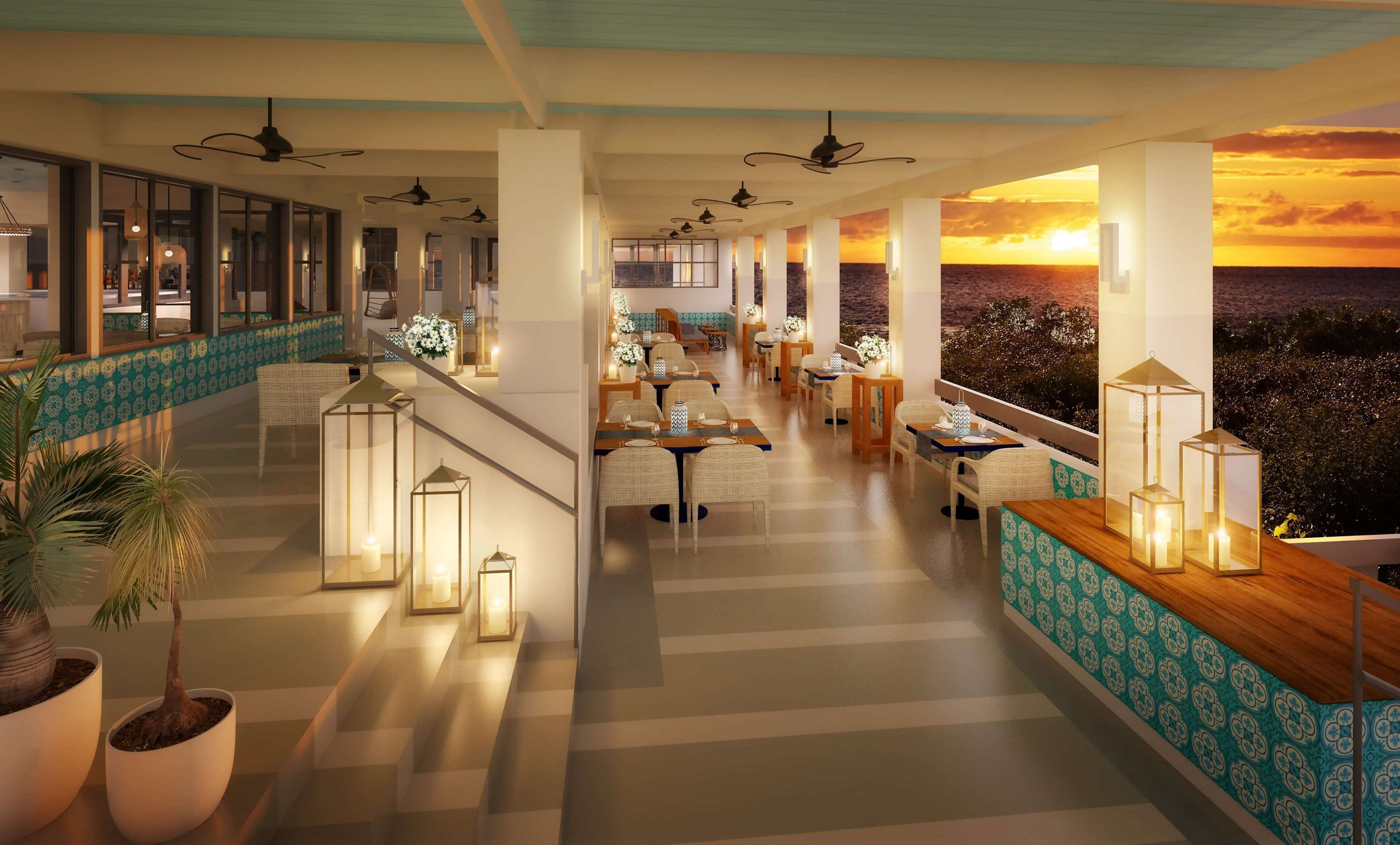 Ein Restaurant mit Sonnenuntergangsblick, Innenbereich und dekorativen Laternen.