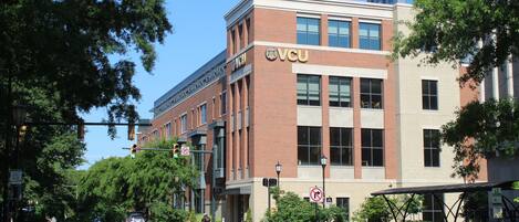A building with a prominent 'VCU' sign, indicating it is likely a university or educational institution.