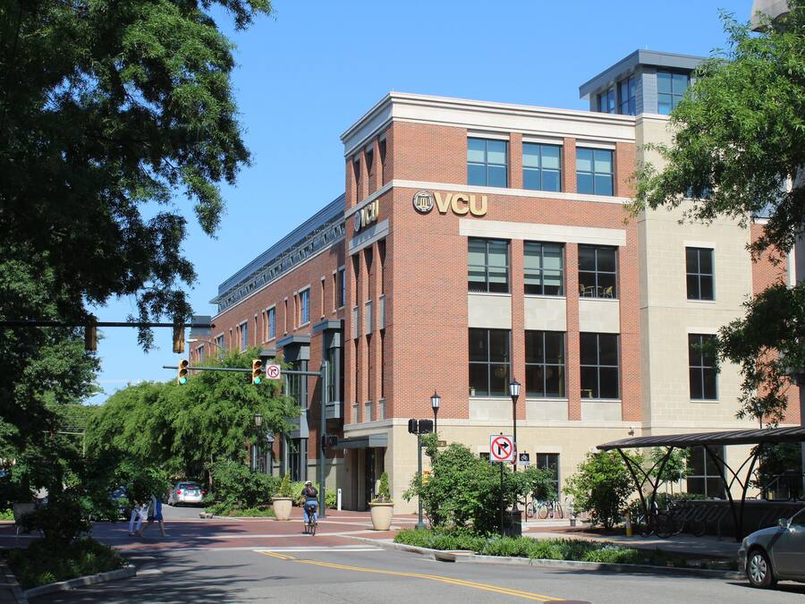 A building with a prominent 'VCU' sign, indicating it is likely a university or educational institution.