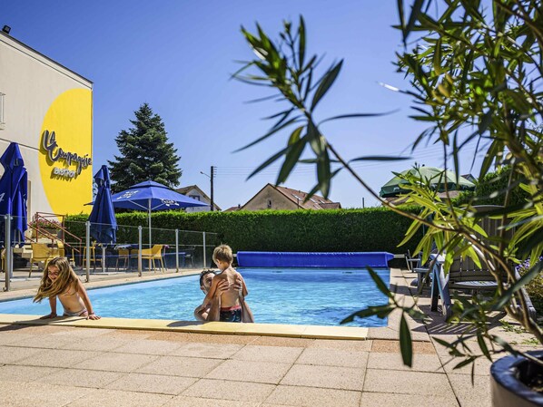 Seasonal outdoor pool, open 8:00 AM to 10:00 PM, pool loungers