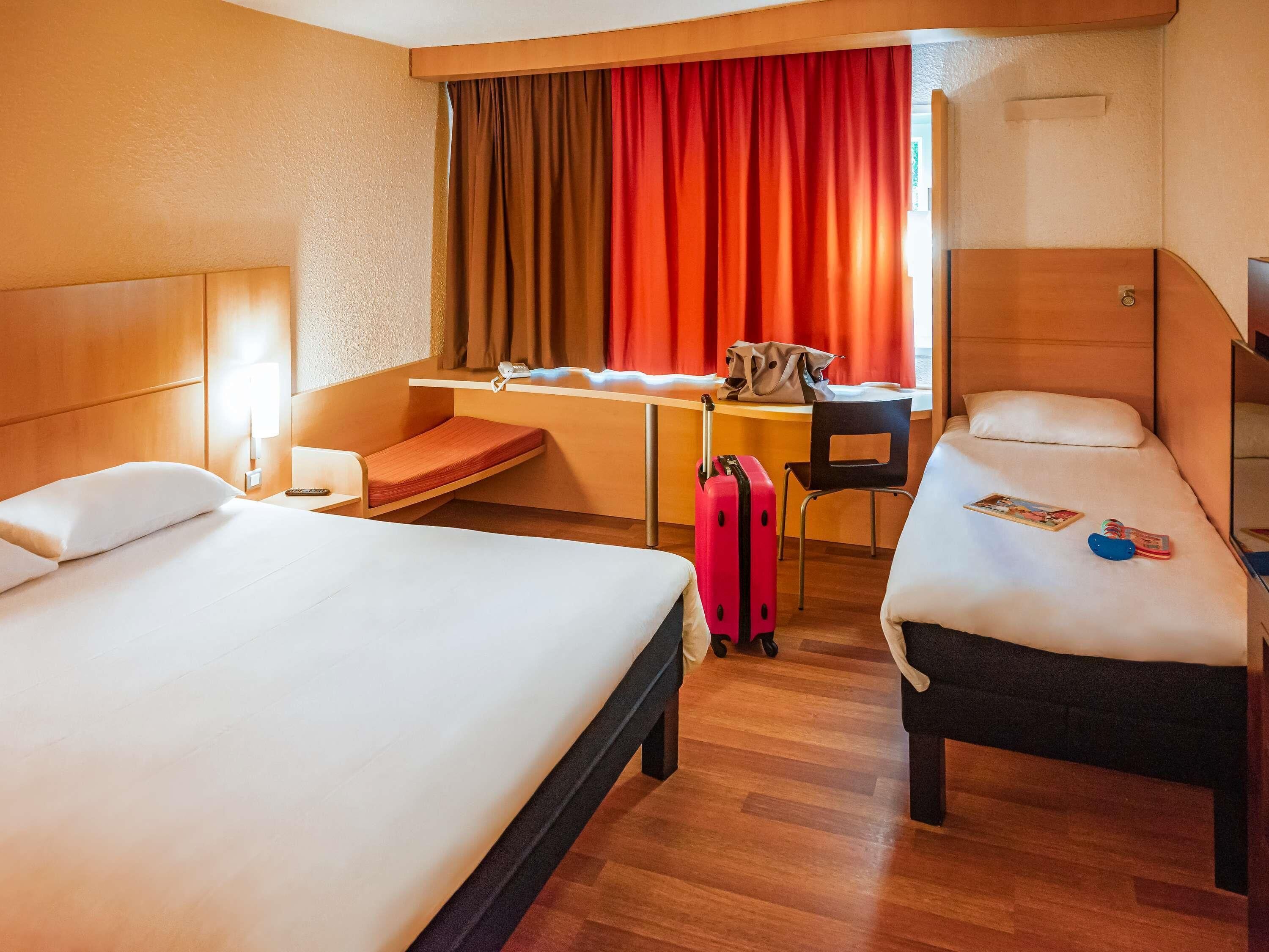 standard room, multiple beds | in-room safe, individually furnished, desk, blackout curtains