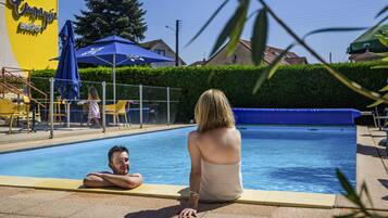 Seasonal outdoor pool, open 8:00 AM to 10:00 PM, sun loungers