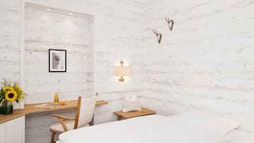Une chambre à coucher comprenant un lit, un bureau, une chaise, une table de chevet, une lampe, un tableau accroché au mur et une décoration murale représentant une tête de cerf.