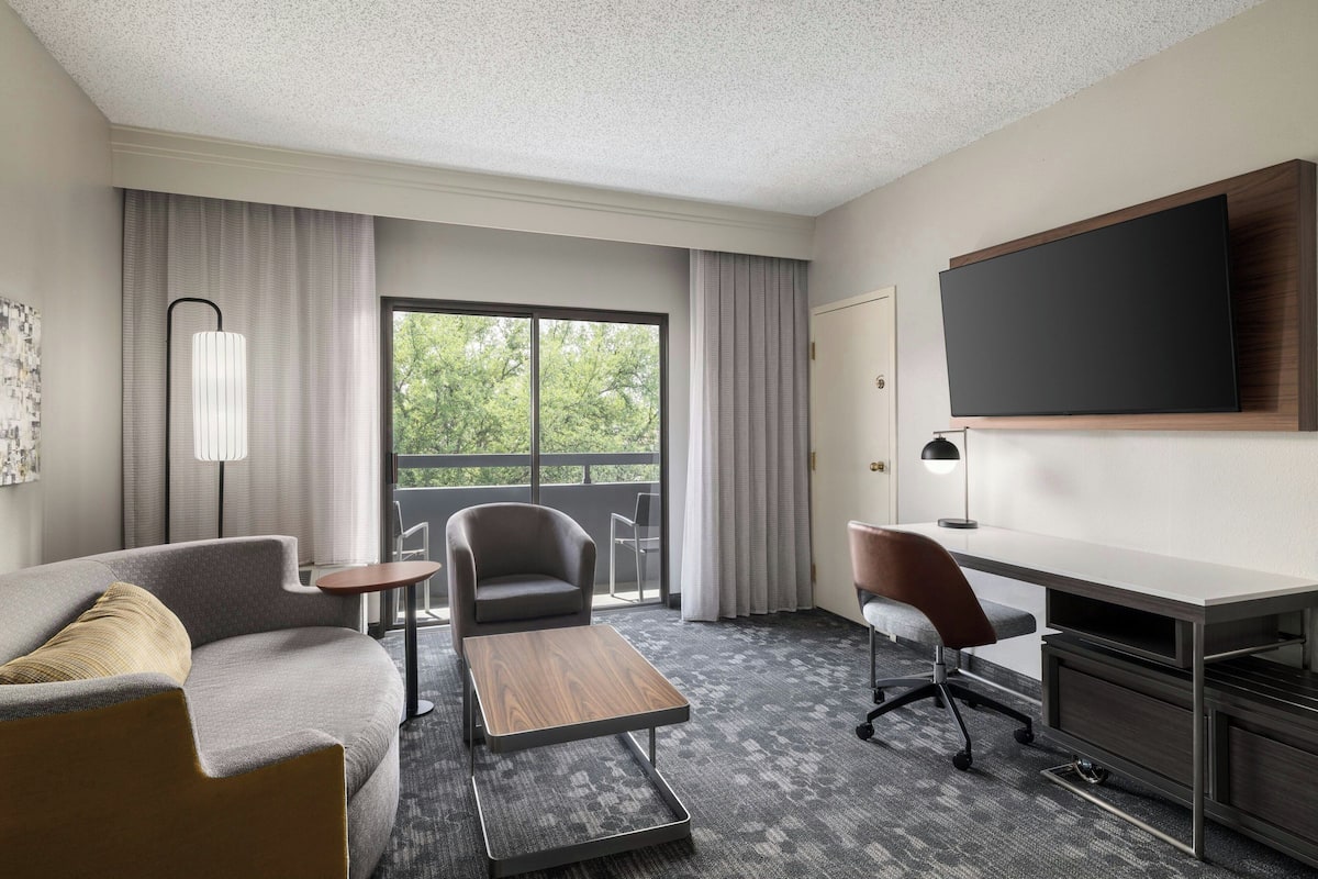 Suite, 2 Double Beds | Living area | 24-inch LCD TV with cable channels, TV