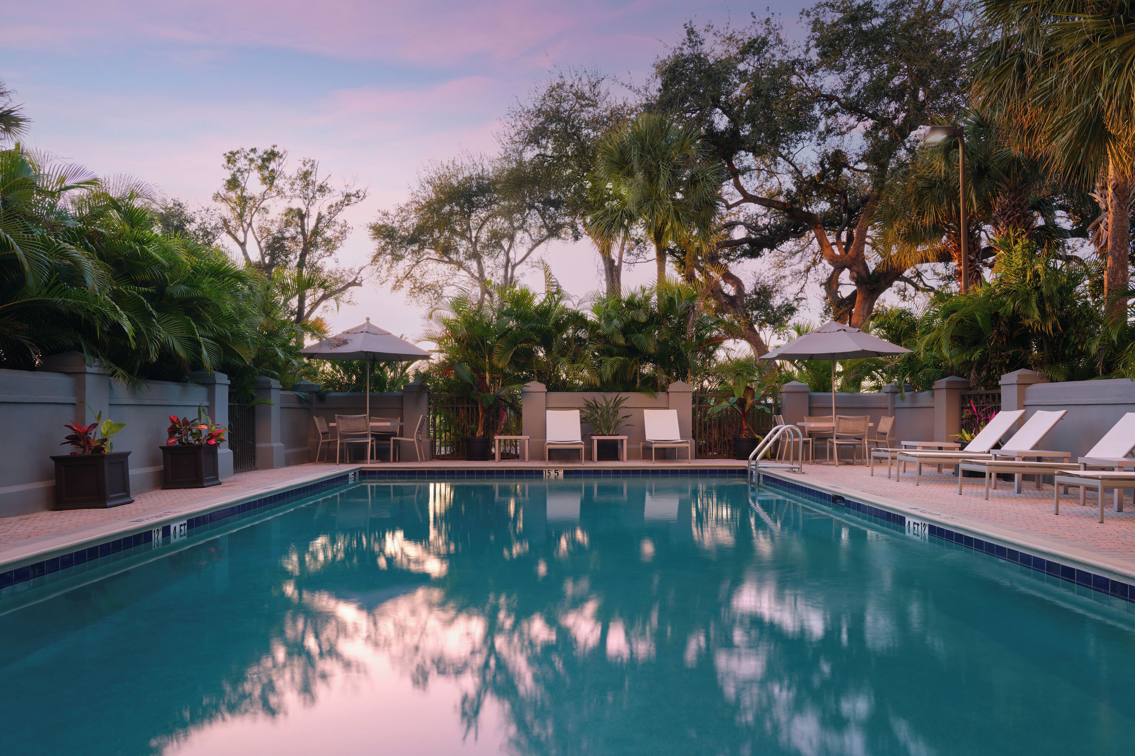 Outdoor pool, open 10:00 AM to 10:00 PM, pool loungers