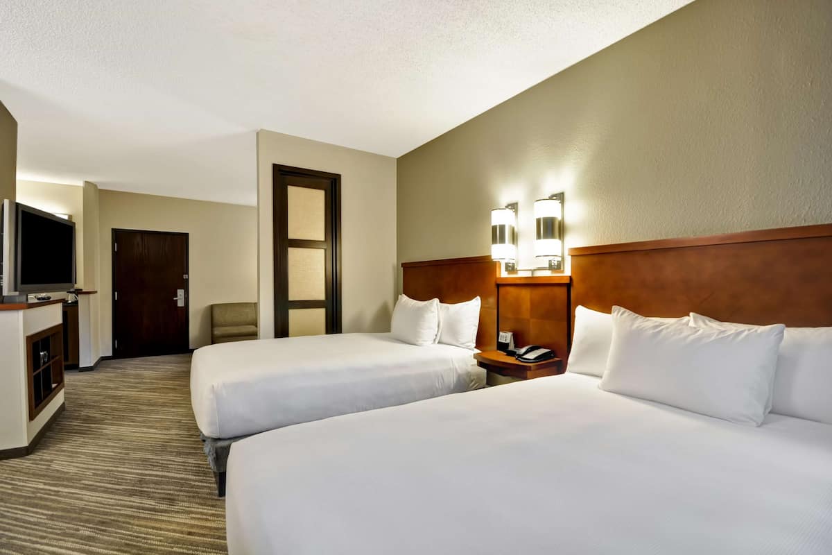Premium bedding, desk, laptop workspace, blackout curtains