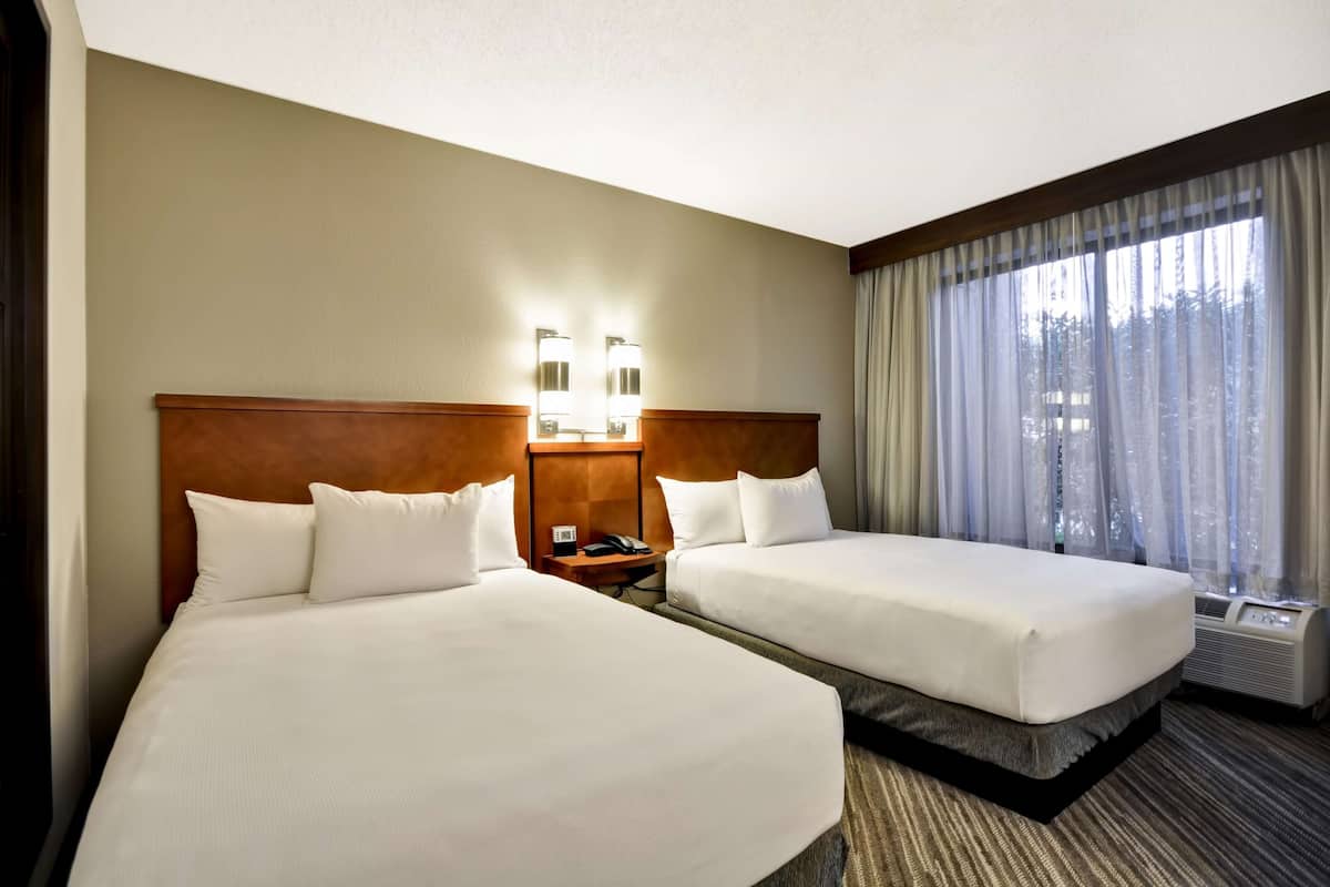 Premium bedding, desk, laptop workspace, blackout curtains