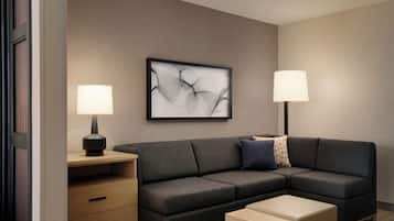 Premium bedding, desk, laptop workspace, blackout drapes