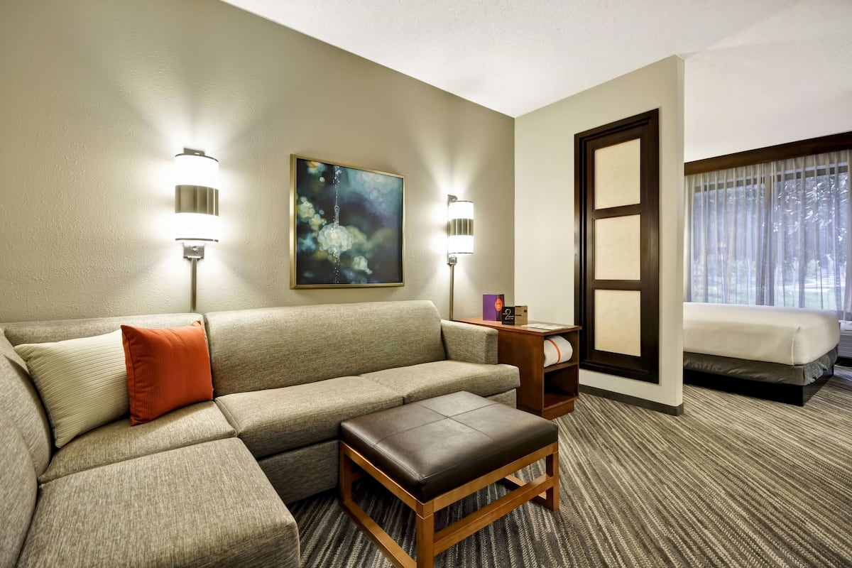 Premium bedding, desk, laptop workspace, blackout curtains