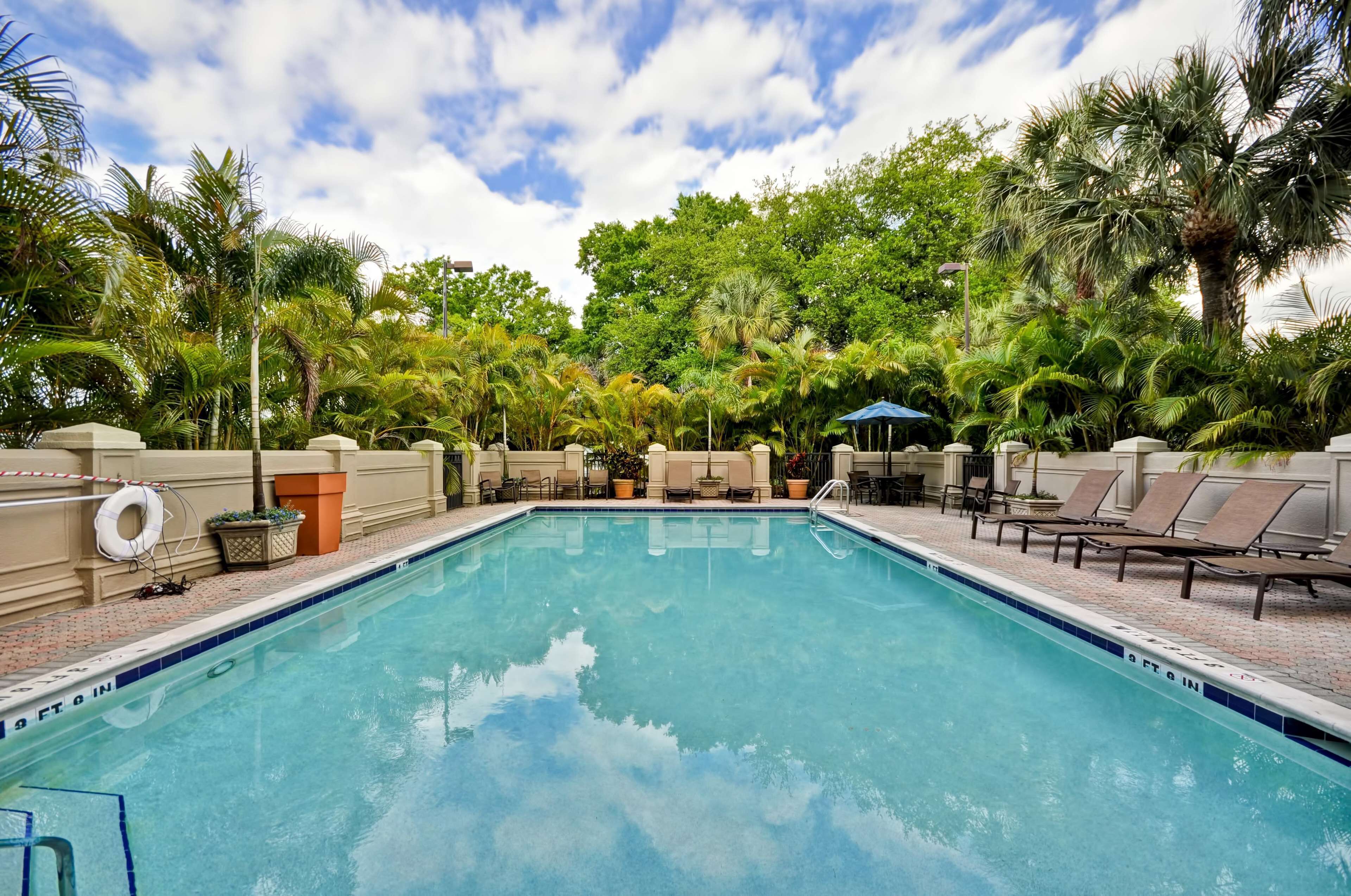 Outdoor pool, open 10:00 AM to 10:00 PM, pool loungers