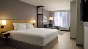 Premium bedding, desk, laptop workspace, blackout curtains