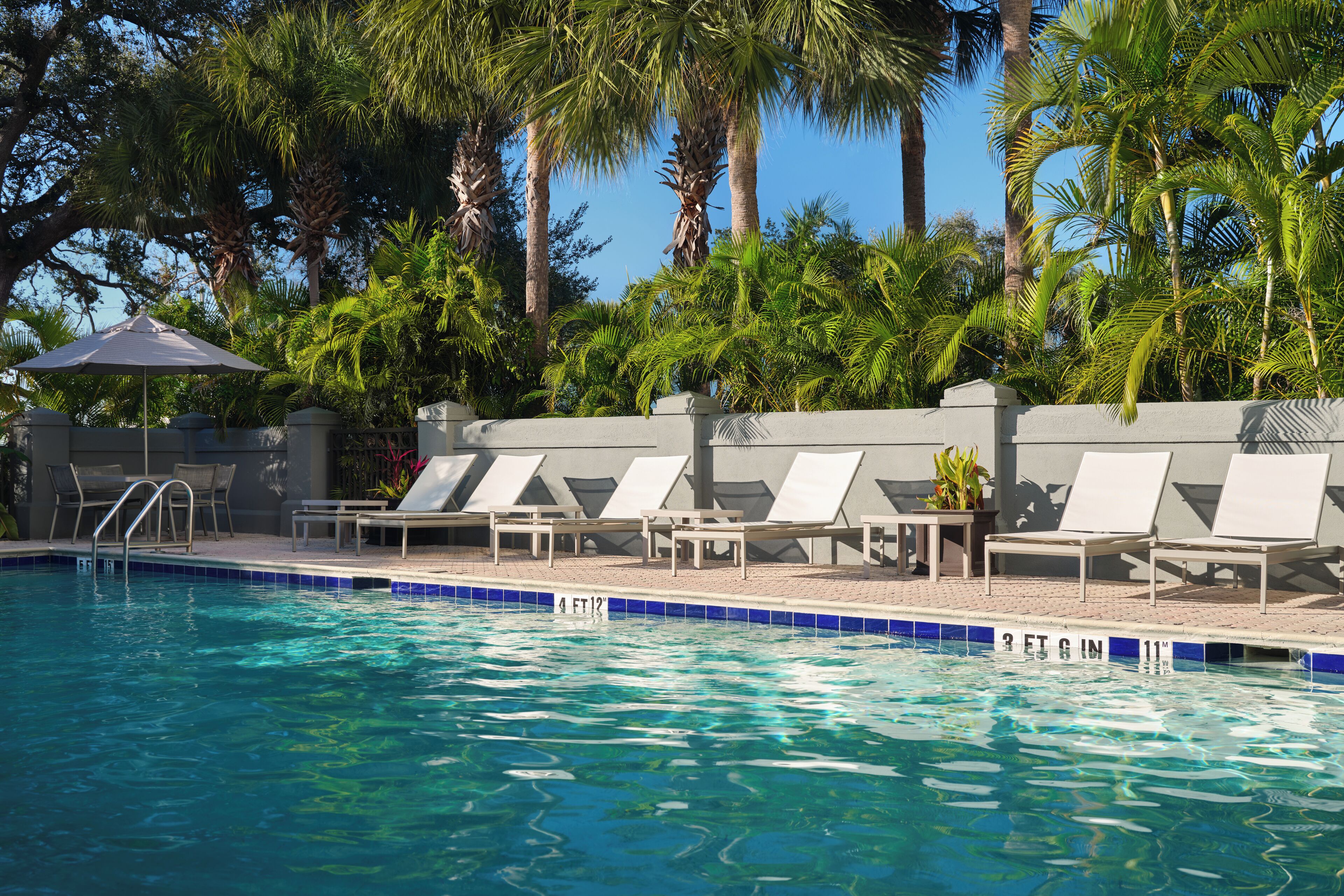 Outdoor pool, open 10:00 AM to 10:00 PM, pool loungers